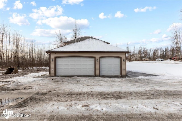 view of snow covered garage