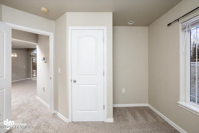 unfurnished bedroom with light colored carpet