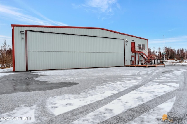 view of snow covered garage