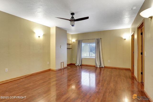 unfurnished room featuring ceiling fan and hardwood / wood-style floors