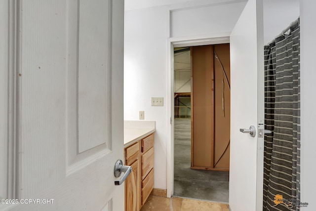 bathroom with vanity and tile patterned flooring