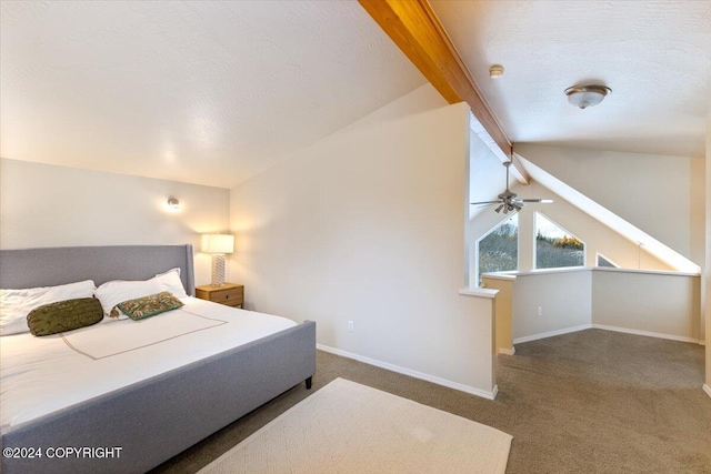 carpeted bedroom featuring a textured ceiling and vaulted ceiling with beams