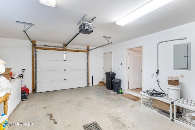 garage featuring a garage door opener and electric panel