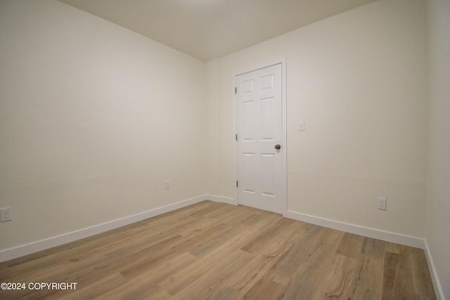 empty room with light hardwood / wood-style floors