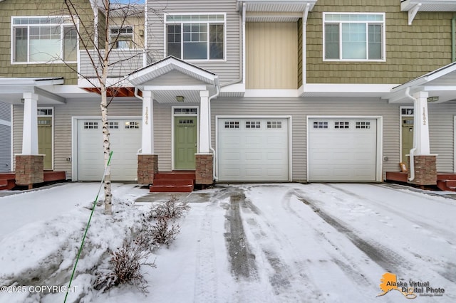 view of snow covered garage