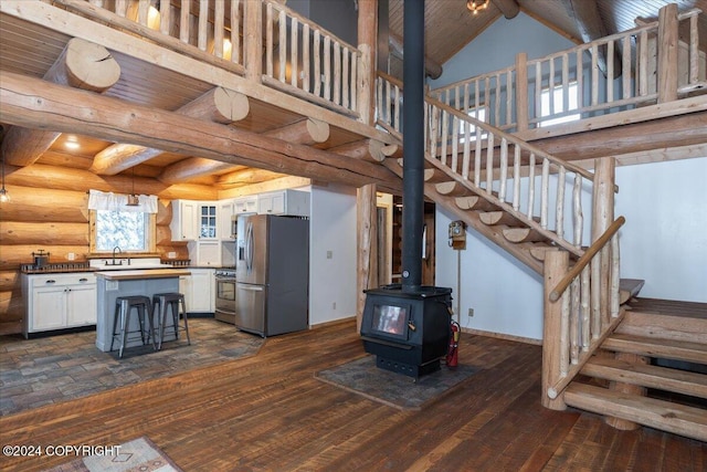 TL-215 Old Valdez Trl, Salcha, AK 99714 - kitchen with stainless steel appliances, white cabinets, glass insert cabinets, dark wood-style flooring, and a towering ceiling