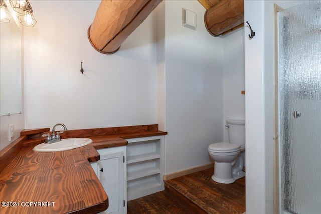 TL-215 Old Valdez Trl, Salcha, AK 99714 - bathroom featuring wood finished floors, vanity, and an enclosed shower