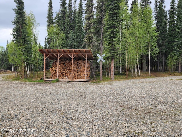 TL-215 Old Valdez Trl, Salcha, AK 99714 - view of outbuilding with a forest view and a pergola
