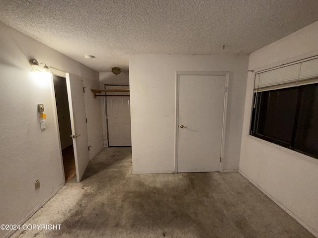 9231 Campbell Ter, Anchorage, AK 99515 - corridor with a textured ceiling and baseboards