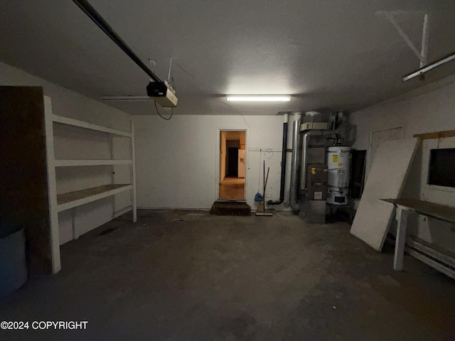 9231 Campbell Ter, Anchorage, AK 99515 - garage with water heater and a garage door opener