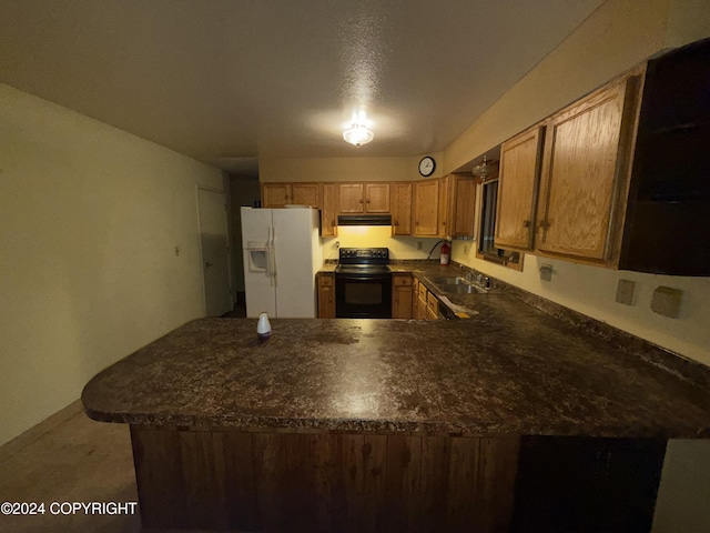 9231 Campbell Ter, Anchorage, AK 99515 - kitchen with white fridge with ice dispenser, black electric range oven, under cabinet range hood, dark countertops, and a peninsula