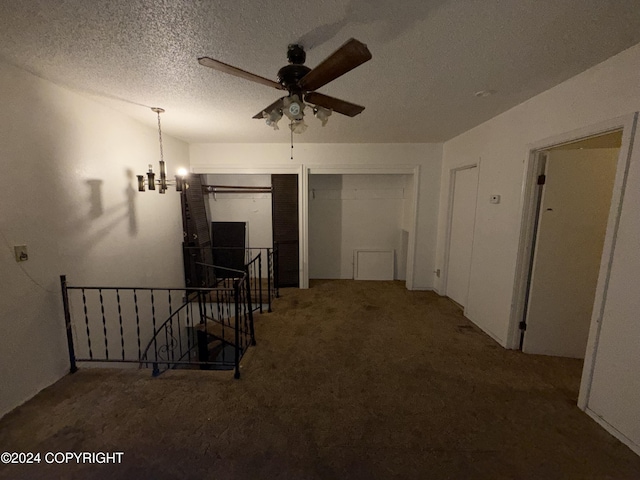 9231 Campbell Ter, Anchorage, AK 99515 - hallway with an upstairs landing, carpet floors, a chandelier, and a textured ceiling