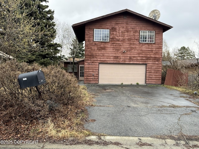 9231 Campbell Ter, Anchorage, AK 99515 - view of property exterior featuring driveway and an attached garage