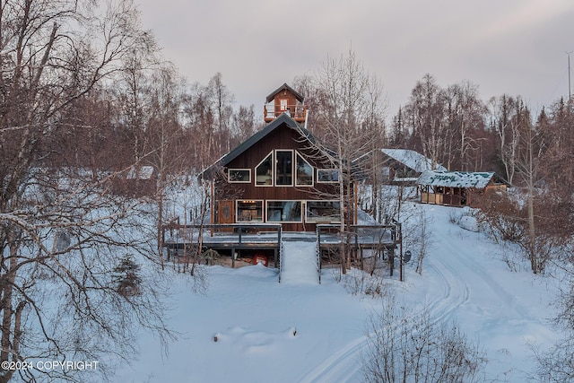 view of snow covered house