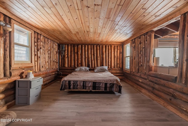 unfurnished bedroom with hardwood / wood-style flooring, wooden ceiling, and wooden walls