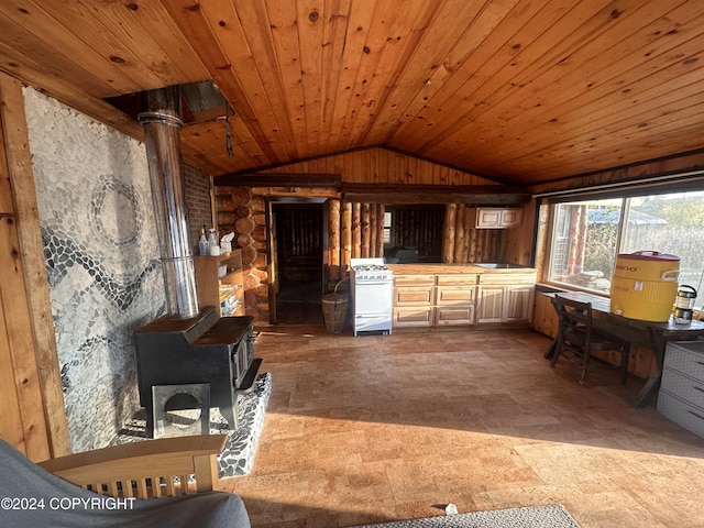 interior space featuring wooden ceiling, lofted ceiling, and wood walls