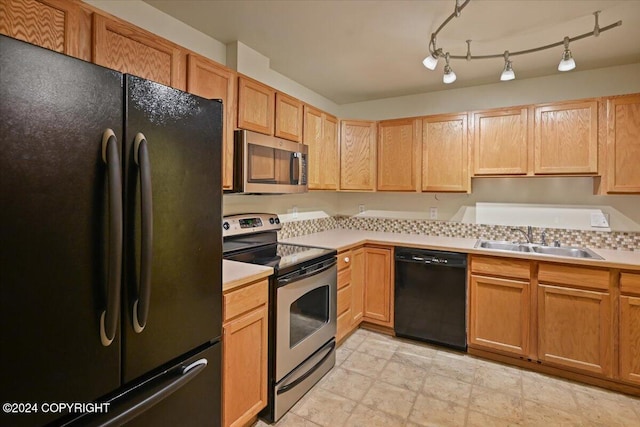 kitchen with sink and black appliances