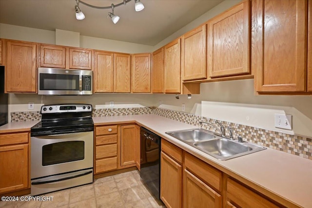 kitchen with sink and appliances with stainless steel finishes