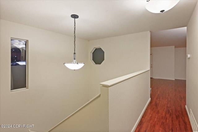 hall with dark hardwood / wood-style floors