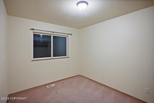 unfurnished room with carpet floors