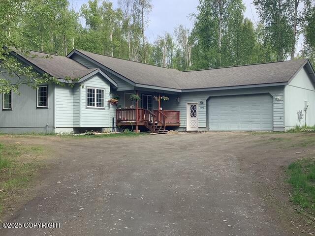 4570 S Navigators Cir, Wasilla, AK 99623 - single story home featuring driveway, a porch, and a garage