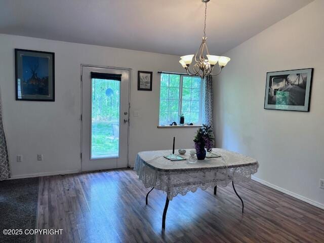 4570 S Navigators Cir, Wasilla, AK 99623 - dining area with a chandelier, wood finished floors, baseboards, and lofted ceiling