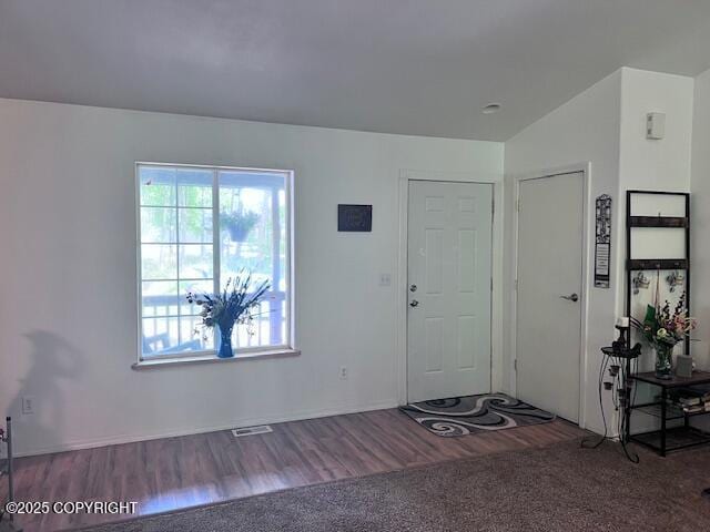 4570 S Navigators Cir, Wasilla, AK 99623 - entryway featuring healthy amount of natural light, wood finished floors, and baseboards