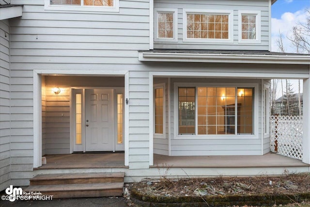 doorway to property featuring covered porch