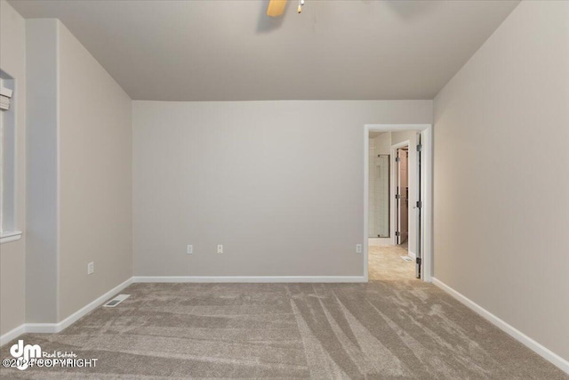 carpeted empty room with ceiling fan