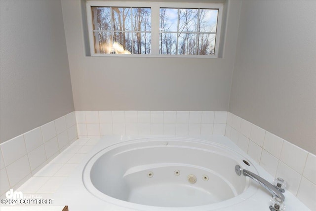 bathroom featuring a relaxing tiled tub