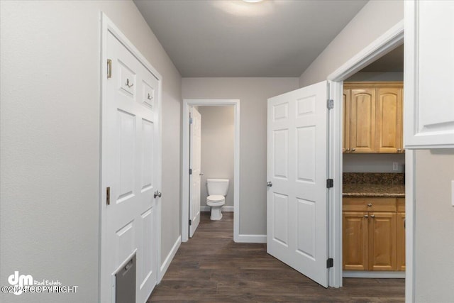 corridor with dark hardwood / wood-style floors