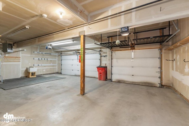 garage featuring a garage door opener and sink