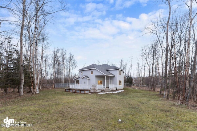 exterior space with a front yard and a deck