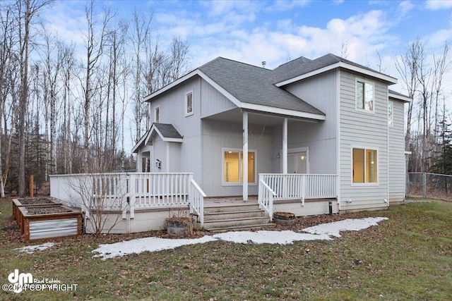 view of front of house with a porch and a front yard