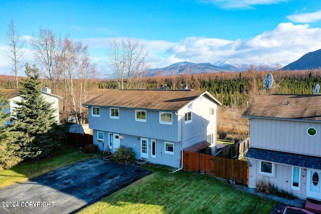 birds eye view of property featuring a mountain view