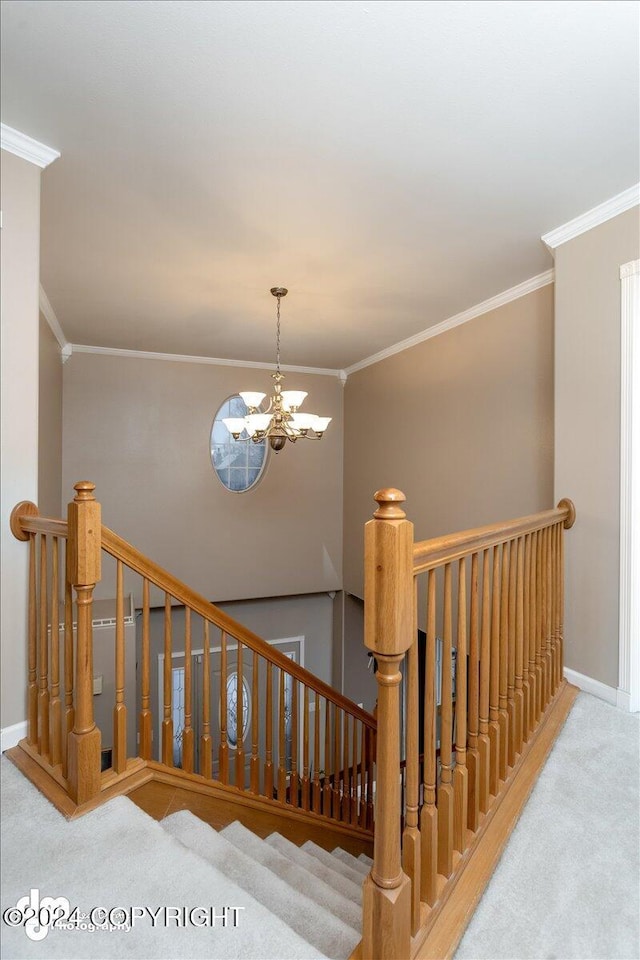 staircase featuring crown molding, carpet, and a notable chandelier