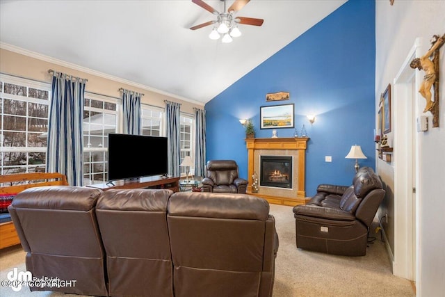 carpeted living room featuring high vaulted ceiling, ornamental molding, and ceiling fan