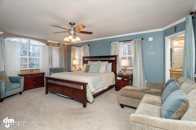 carpeted bedroom featuring connected bathroom, crown molding, and ceiling fan