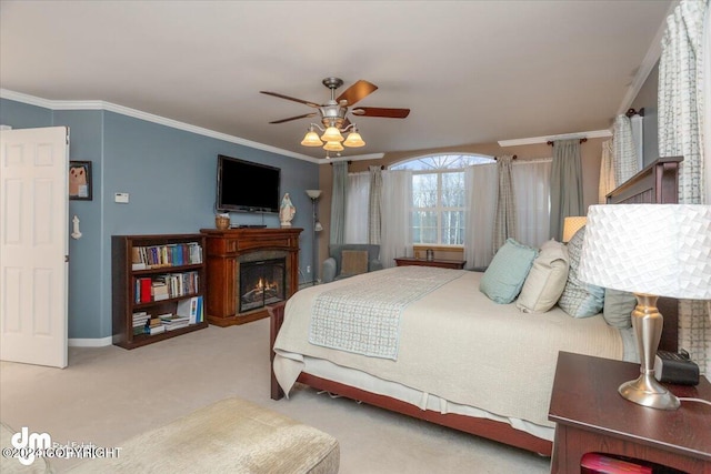 bedroom with crown molding, light colored carpet, and ceiling fan