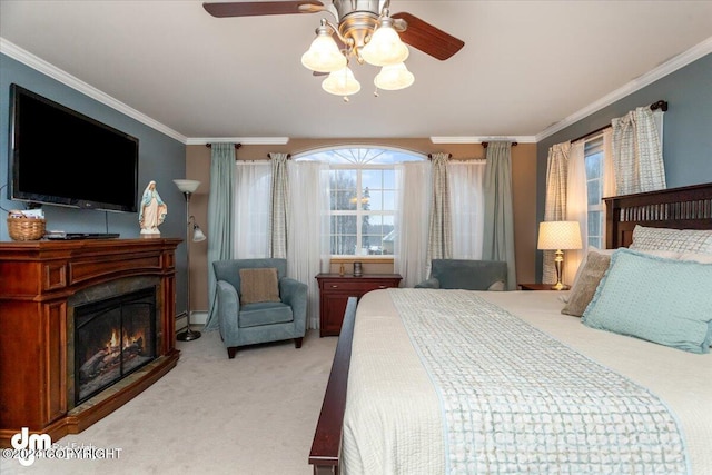 carpeted bedroom featuring multiple windows, ornamental molding, ceiling fan, and baseboard heating