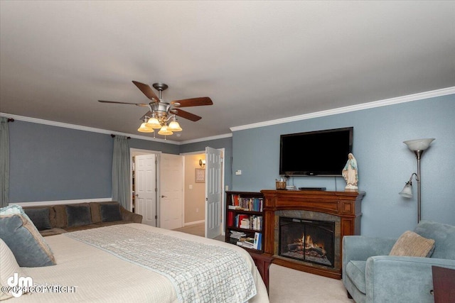 carpeted bedroom with a premium fireplace, ceiling fan, and crown molding