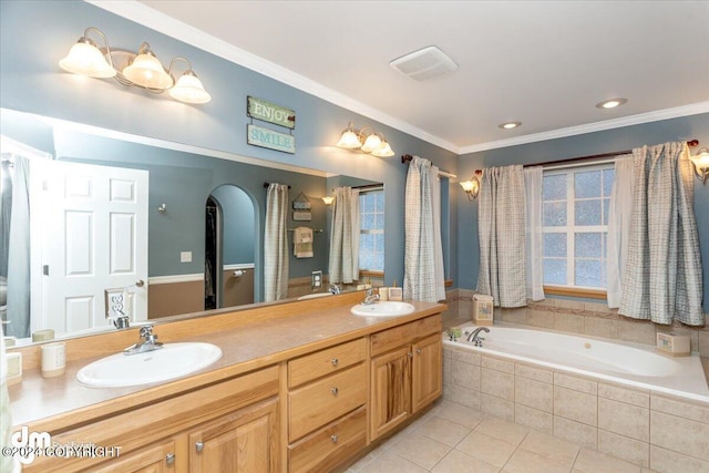 bathroom featuring ornamental molding, vanity, tile patterned flooring, and tiled tub