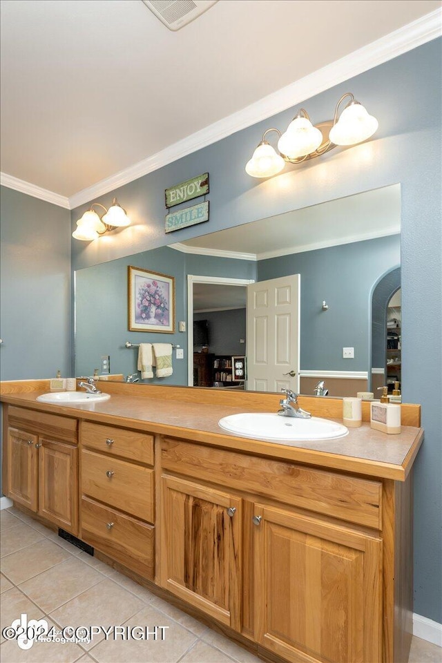 bathroom with vanity, ornamental molding, and tile patterned floors