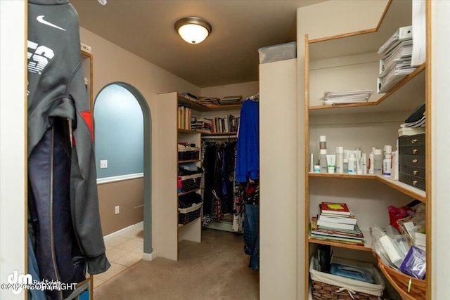 spacious closet featuring light tile patterned floors