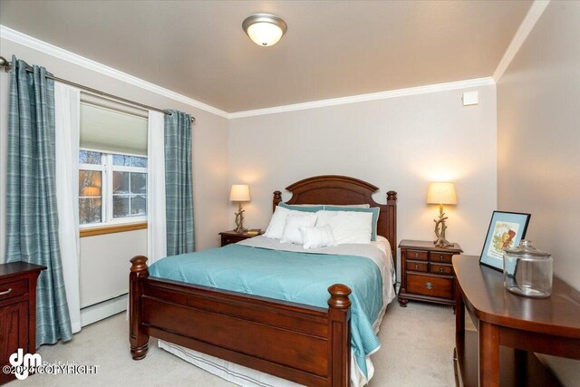 bedroom featuring ornamental molding, a baseboard heating unit, and light colored carpet