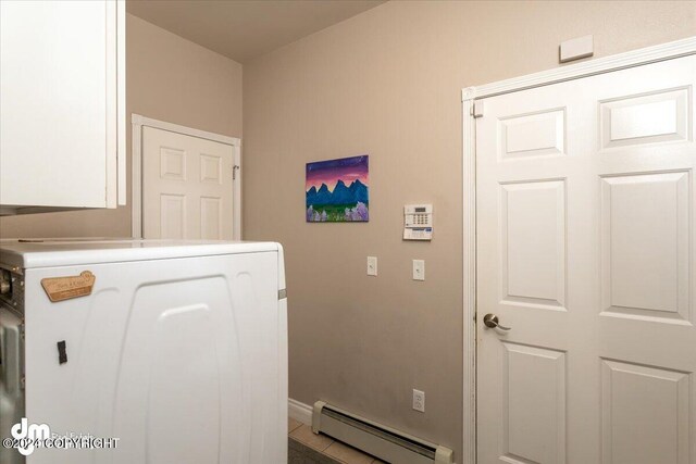 laundry area with washer / clothes dryer and a baseboard heating unit