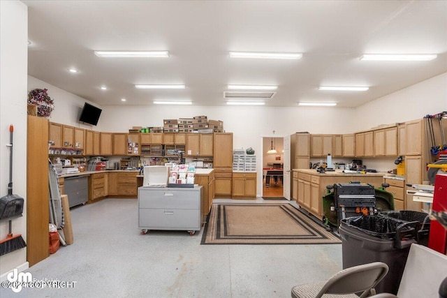 kitchen with stainless steel dishwasher and a center island