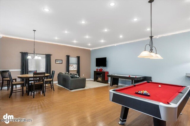 playroom with ornamental molding, wood-type flooring, and pool table