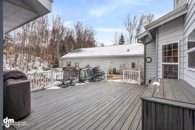 view of snow covered deck