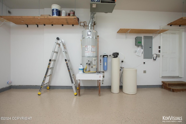 garage featuring electric panel and strapped water heater